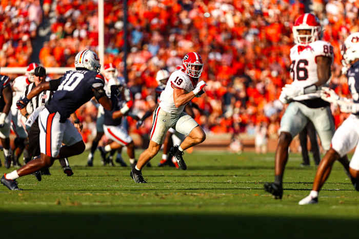 Brock Bowers springs forward after a reception in the first half of the matchup vs Auburn - Photo Credit/Tony Walsh - UGAA